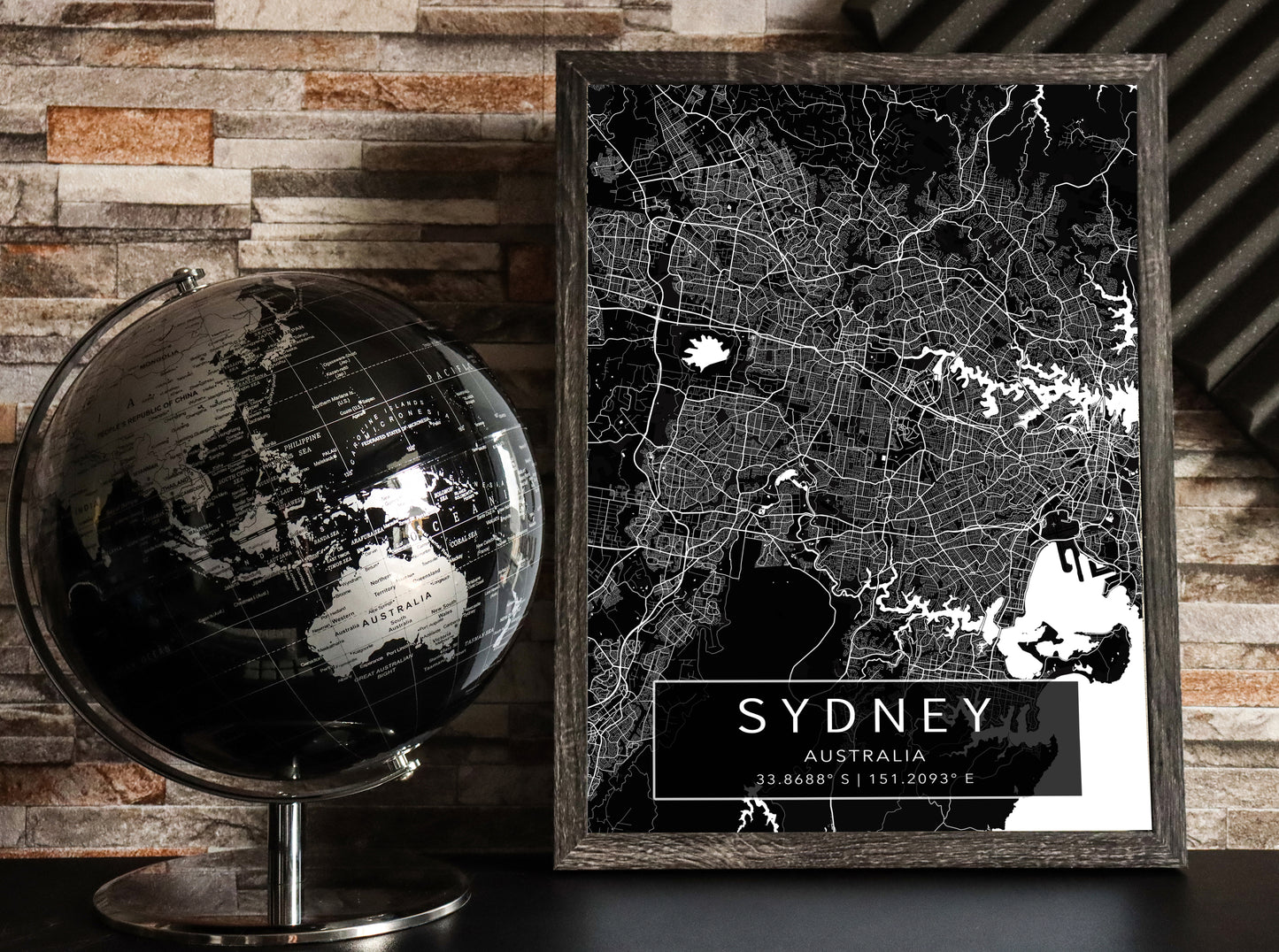 Black and white map print of Sydney, Australia. The dark background highlights the city's street layout and landmarks, with coordinates listed beneath the city name.