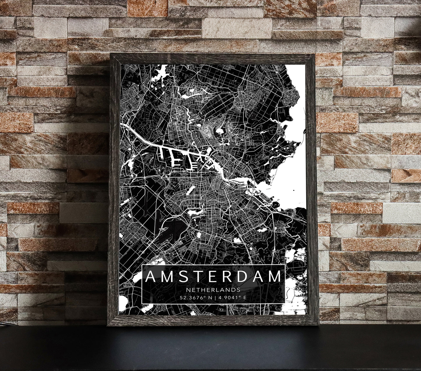 Black and white map print of Amsterdam, Netherlands. The dark background highlights the city's street layout and landmarks, with coordinates listed beneath the city name.