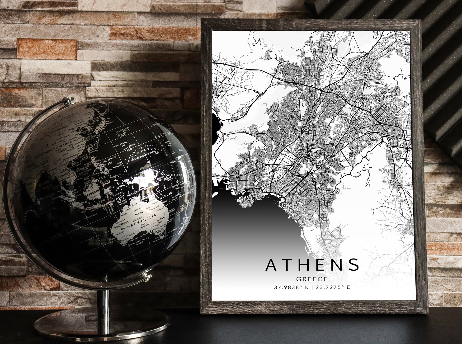 Black and white map print of Athens, Greece. The map displays intricate city streets and geographical details, with coordinates listed beneath the city name