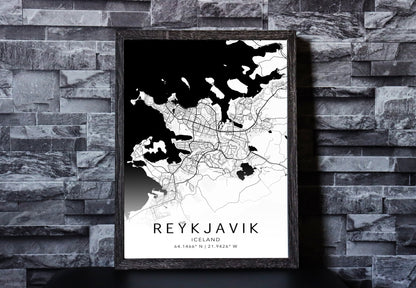 Black and white map print of Reykjavik, Iceland. The map displays intricate city streets and geographical details, with coordinates listed beneath the city name